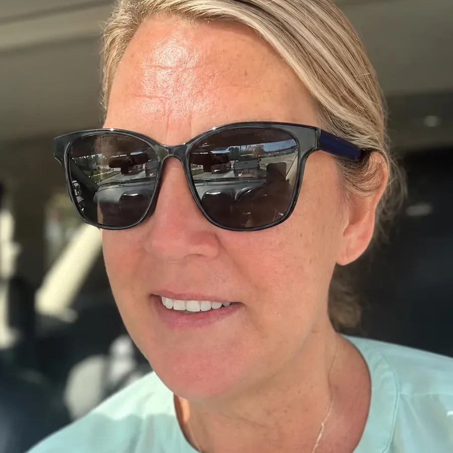 Dee, Mrs. Smash, smiling in sunglasses on a sunny Jupiter morning