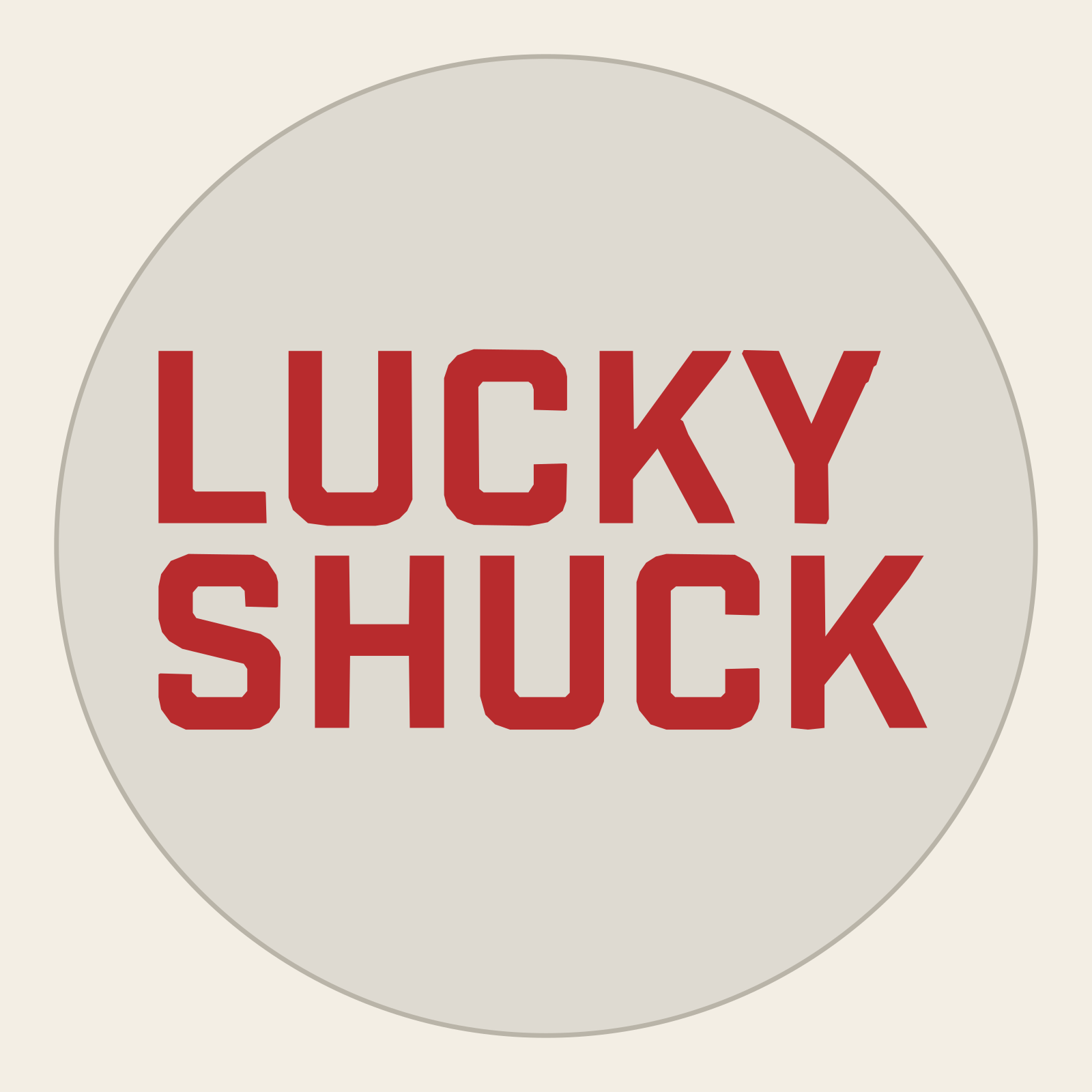 Top-view CAD drawing of a round Lucky Shuck coaster, with the main lettering shown in red